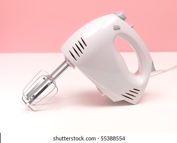 An Electric Hand Mixer On A Kitchen Bench