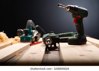 Electric hand tools (battery drill, electric drill, electrical planer). Carpentry workshop - Powered by Shutterstock