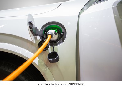 Electric hybrid car plug-in in to charger to charging electric power to battery to reserve energy.
