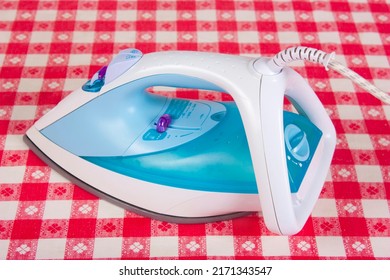 Electric Iron Isolated On Table