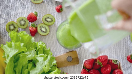 Electric juicer and various fruits on the kitchen counter Healthy living concepts. New Year's resolutions. New start. Weight loss concepts. - Powered by Shutterstock