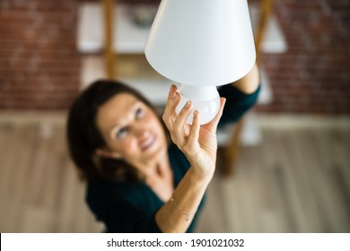 Electric LED Lightbulb Change In Light At Home - Shutterstock ID 1901021032