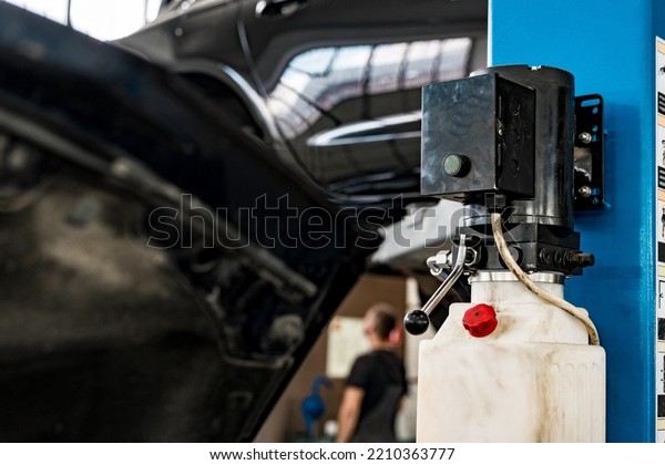 The
electric lift for cars in the car repair
service