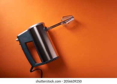 Electric Mixer On An Orange Background, Top View, Place For An Inscription