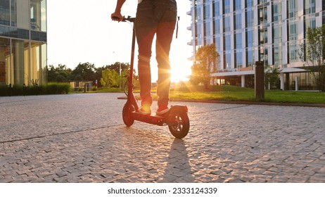 electric mobility scooter rider, man ride sharing or rent personl eco transportation - Powered by Shutterstock