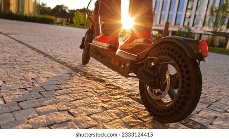 electric mobility scooter rider, man ride sharing or rent personl eco transportation - Powered by Shutterstock