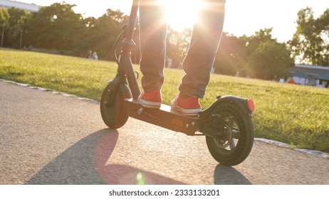 electric mobility scooter rider, man ride sharing or rent personl eco transportation - Powered by Shutterstock