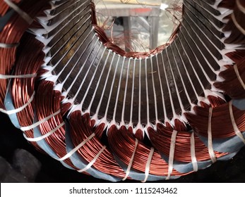 Electric motor stator with winding coil , view of inside of electric induction motor under repairing.   