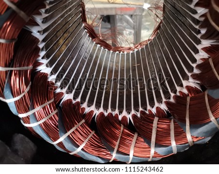 Electric motor stator with winding coil , view of inside of electric induction motor under repairing.   