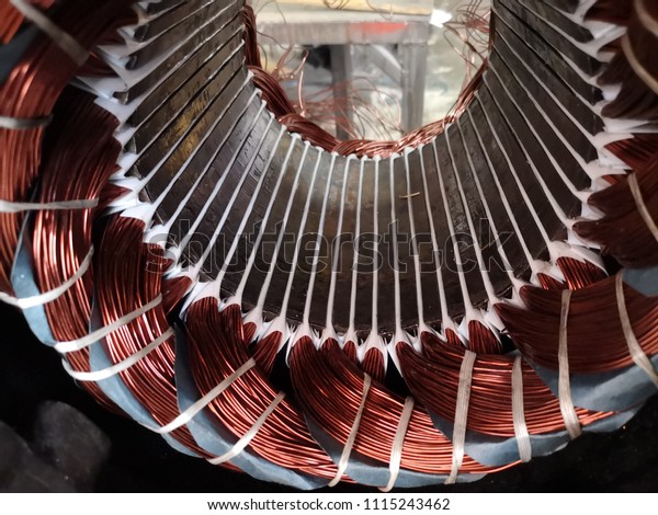 Electric motor stator\
with winding coil , view of inside of electric induction motor\
under repairing.   