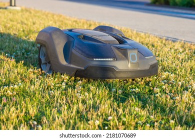 Electric Mowing Robot Working In City Park