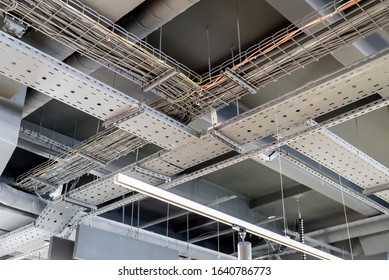 electric networks, cable trays, low-voltage networks of different colors on the ceiling