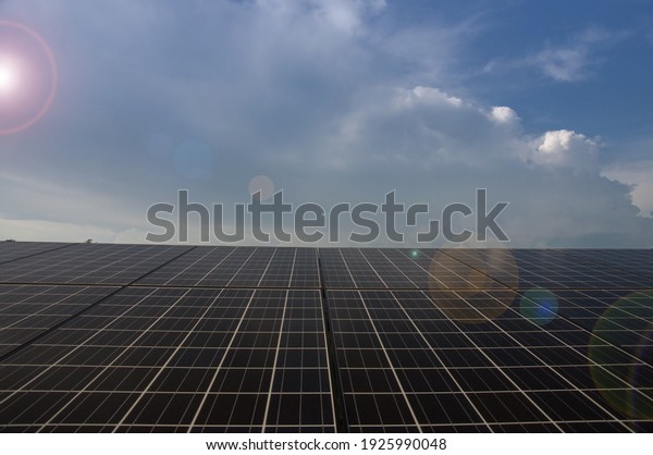 Electric\
photovoltaic solar panels cells on a\
field