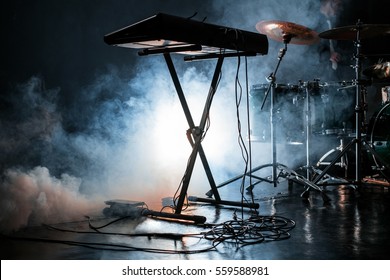 Electric Piano And Drum Kit In Dark Smoky Studio