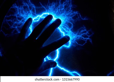 Electric Plasma Ball On Dark Background. Static Electricity Model