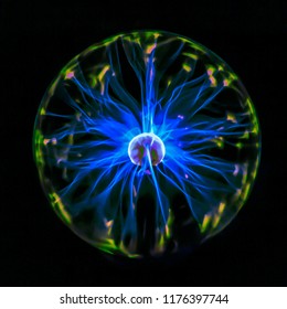 Electric plasma globe with blue energy filaments striking inner surface of glass globe.
