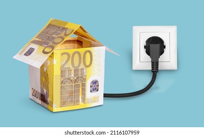 Electric plug with banknotes and extension socket. Rise in electricity prices in the cold winter season