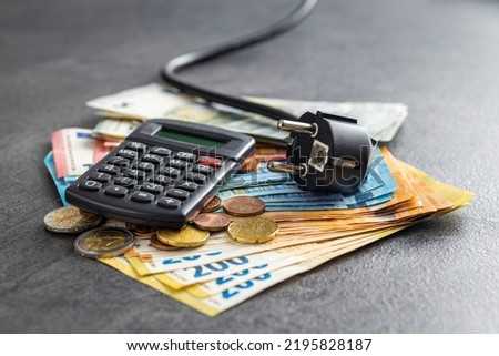 Electric plug, calculator and euro money. Concept of the increasing electricity prices.