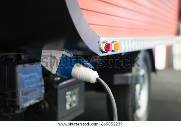 Electric\
plug connect to electric vehicle for charging \
