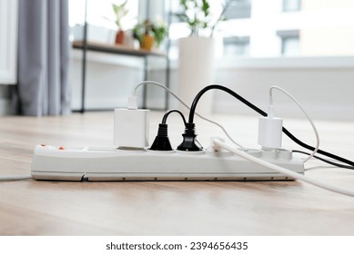 Electric plug put on multiple socket. Electrical equipment, electrical wires and power strips in the house