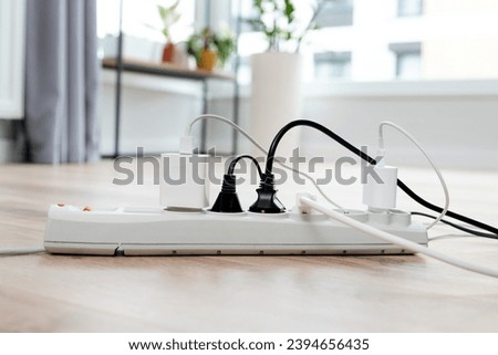 Electric plug put on multiple socket. Electrical equipment, electrical wires and power strips in the house