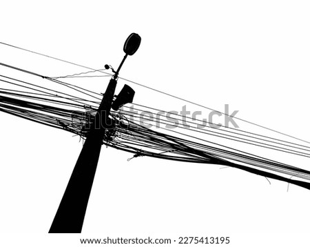 Black​ and​ white​ Electric Pole With Black Messy String Cable isolated​ on​ white​ background.