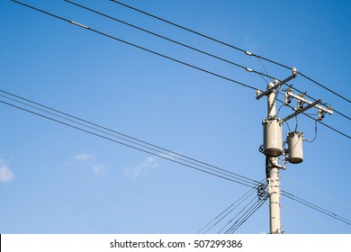 The electric pole and electric transformer with clear blue sky 