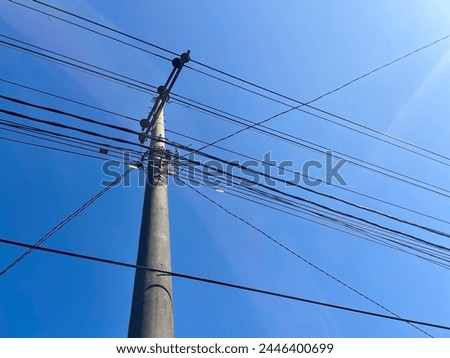 Electric pole under clear sky