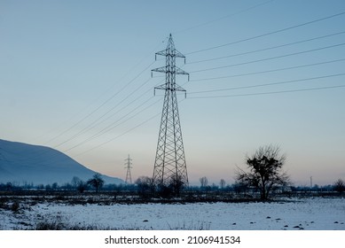 Electric Power Grid Cables Distribution Outdoors In Sunset