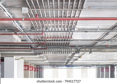 Electric power lines on the ceiling  of construction in car park building