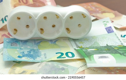 Electric Power Strip And Euro Bancnotes. Increasing Cost Of Electricity For Business Users And Residential Customers. Rise In Electricity Prices Concept, Horizontal