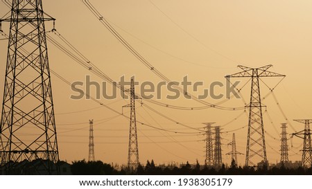 The electric power tower network view in the sunset sunlight