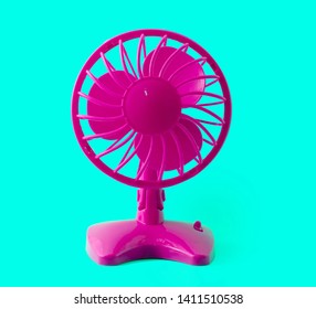 Electric Purple Retro Plastic Fan Isolated On Pastel Blue Background