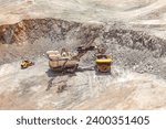 Electric rope shovel loading a dump truck at a copper mine in Peru