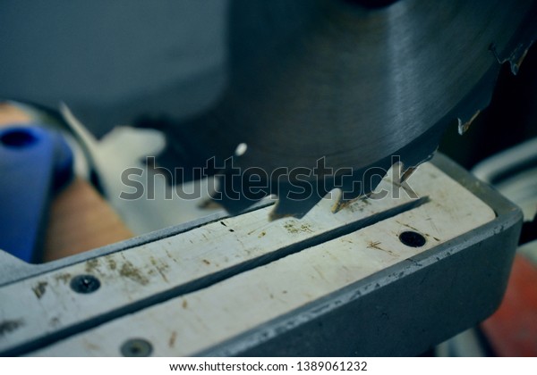 electric saw\
blade, fragment, blurred\
background