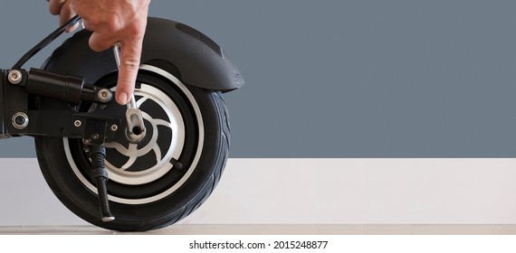 Electric scooter maintenance service concept. Repair service. Technological concept. Panoramic format.