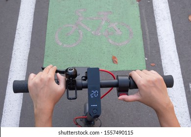 Electric Scooter On Bicycle Lane Concept. Electric Urban Transportation. E Scooter Law Regulation Concept.