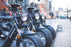 Electric Scooters, E-bikes, And Motorcycles In The City Waiting To Get Picked Bij A Costumer