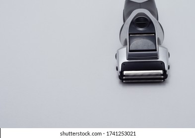 Electric shaver head. Electric shaver on a white background. Electric shaver head. shaving