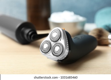 Electric shaver for man on table - Shutterstock ID 1031685460