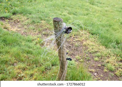 Electric Shepherd Stake By A Pasture With Wire