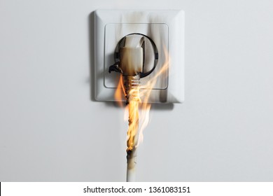 Electric Short Circuit Causing Fire On Plug Socket At Home