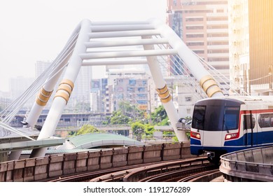 Electric Skytrain Is Running In Downtown Of Bangkok Metropolitan Region. It Is Running On Railroad Tracks.