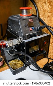 Electric Solder With Tin And Cleaning Brass On The Work Table.