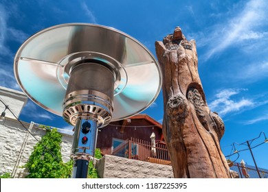 Electric Stainless Steel Metal Gas Burning Outdoor Patio Heater Along With Tree Trunk On The Route 66.