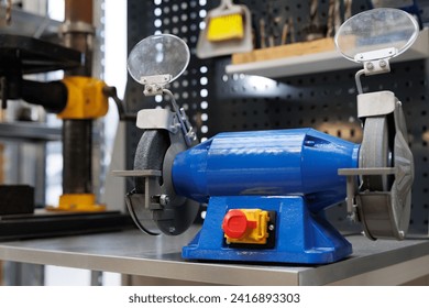 Electric steel grinding wheel in a car repair shop - Powered by Shutterstock