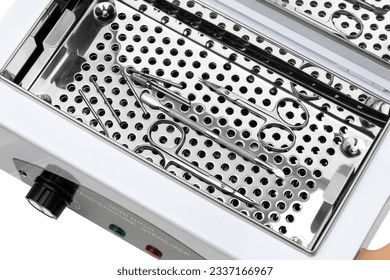 Electric sterilizer for medical devices on a white background. Mini high temperature sterilizer close-up on a white background. - Shutterstock ID 2337166967