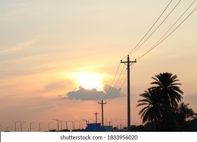 Electric stick on the road with sunset background
