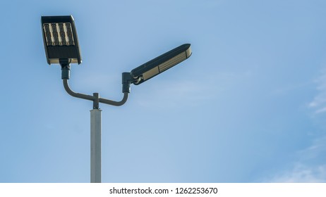 Electric streel lamp in parking lot. Wide format with copy space. - Shutterstock ID 1262253670
