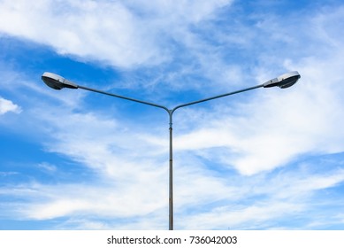 Electric street light pole on blue vivid sky in day light